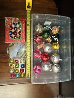 Overview of ornaments, measuring tape for scale