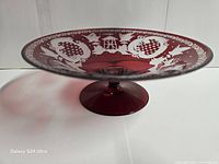 Side view showing ruby red bowl profile on pedestal