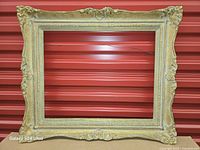 Front view showing entire gilt frame and relief details