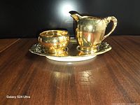 creamer, sugar bowl and tray front view