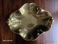 Top view showing gold lustre finish and scalloped shape