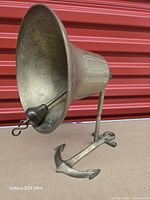 Front left view showing bell mouth, clapper, anchor base