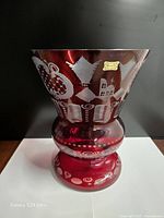Front view of large ruby red cut-to-clear vase with gold Egermann label