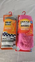 Front view of two packaged pairs of Heat Holders socks