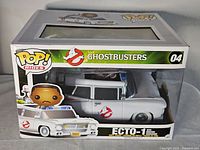 Front view of boxed Funko POP! Rides Ghostbusters #04 Ecto-1 with Winston