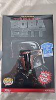 Front of sealed Funko Pop! Tees box showing Boba Fett helmet art