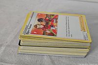 Stack of Pokémon cards with Gym Trainer on top