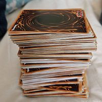 Side view of stacked Yu-Gi-Oh! cards showing card backs