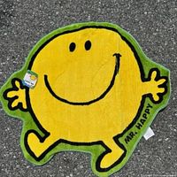 Full view of Mr. Happy shaped rug placed on floor