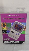 Front of retail box showing My Arcade Go Gamer Classic branding and 300 games note