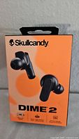 Front of retail box showing Skullcandy Dime 2 earbuds image and branding