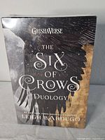 Front of sealed slipcased book set showing title and artwork