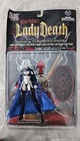 Front view sealed Lady Death figure with accessories