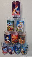 Front view of all ten Disney Collector Series Burger King glasses stacked in a pyramid