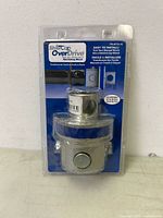 Front view of sealed SilverCap OverDrive ratcheting winch cap in retail packaging