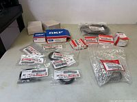Full lot overview on table showing all packaged Yamaha and SKF parts