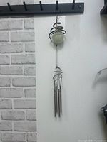 Full view of hanging glow-in-the-dark wind chime