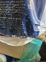 Close-up of lower corner of bag showing weight text