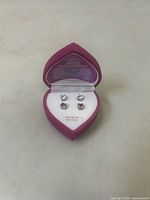 Set of four stud earrings in heart box, full view