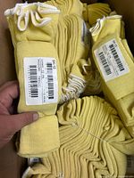 Close-up of tagged yellow sleeve showing SK12 label