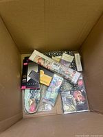 Overview of box contents showing puzzle, phone cases, floral roll, fabric, and additional packages