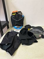 overview of balaclavas, packaged face mask, goggles on table