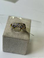 Front view showing two-tone lattice with tanzanite stones