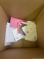 Top view of cardboard box with greeting cards