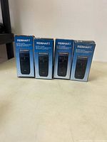 Front view of four boxed Reinhart shavers