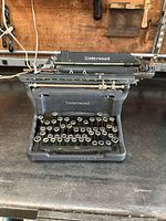 Front view of the antique Underwood typewriter showing entire keyset and brand name on body.
