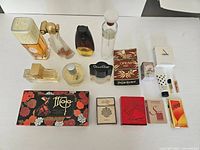Overhead view of assorted vintage perfume bottles, boxed fragrance minis and soap sets