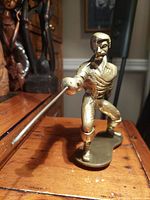 Front angled view showing full swordsman pose and detailing