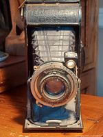 Front view, bellows extended, lens details visible