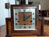 front view of clock showing dial and case design