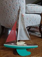 Full view port side of sailboat model showing sails and hull