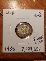 coin in 2x2 holder with handwritten details visible
