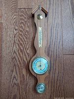 Full view of teak weather station showing thermometer, barometer, hygrometer