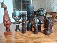 Group shot of all seven carved wood pieces