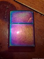 Front view of Zippo rainbow lighter closed