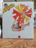 Front of boxed Wupper Airlines mobile showing pilot figure and propeller illustration