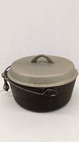Dutch oven with lid in place, showing bail handle and overall form