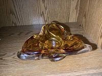 Top view of triangular amber and clear Chalet art glass dish