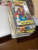 Stack of bagged Marvel comic books with Fantastic Four issue on top