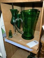 Group shot showing pitcher, two vases and small bottle