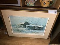 Framed print leaning against wall