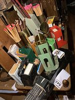 Overall view of assorted match safes, holders, boxes and matches on shelf