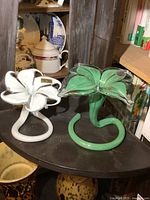 Both Murano glass flower figurines on shelf