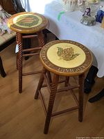 Both wooden bar stools showing overall design