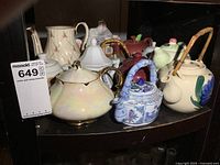 Group shot of all teapots on shelf