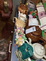 Group of assorted teapots on counter